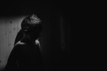 Black And White Portrait Of Sad Anonymous Little Boy