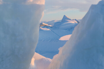 Wall Mural - winter arctic landscape. view of large ice hummocks and snowdrifts. the frozen sea. cold frosty wint