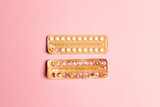 Fototapeta  - Female oral contraceptive pills empty and full blister on a pink background.