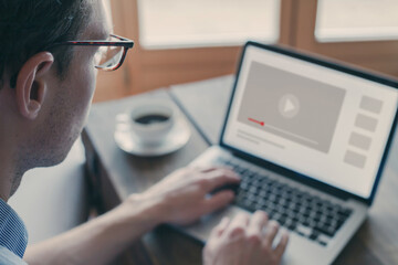 watching webinar, video tutorial or live stream on blurred screen