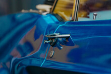 Side View Of A Shiny American Muscle Car Ford Mustang Blue With A Chrome Door Handle. Ford Mustang Convertible Exterior.