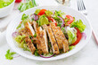 Salad with grilled chicken breast. Fresh vegetable salad with chicken meat. Healthy lunch menu. Diet food.