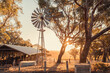 Old rusty windmill on a farm in McLaren Valley at sunset, South Australia