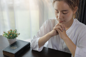 woman hands praying to god with the bible. Woman Pray for god blessing. Religious beliefs Christian life crisis prayer to god.