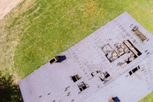 Removal Of Damaged Roof, Replacement With Rural House Residential Rooftop In Aerial View