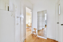 Empty Hallway With White Walls And Doors In Modern Apartment