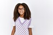 Young african american girl standing over isolated background looking positive and happy standing and smiling with a confident smile showing teeth