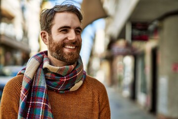 Wall Mural - Young caucasian man with beard outdoors on a sunny day