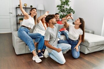 Sticker - Group of young friends having party singing song using microphone at home.