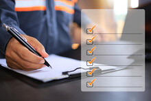 An Industrial Or Shipping Inspector Auditor Supervisor In A Reflective Jacket Is Writing A Pen On A Clipboard To Check The Inventory Of Tasks That Need To Be Done And Has A Checklist Icon On The Right