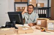 © Krakenimages.com - Senior man working at small business ecommerce wearing headset clueless and confused with open arms, no idea and doubtful face.