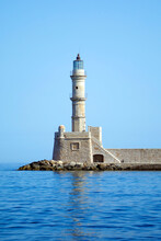 Old Lighthouse Guarding The Entrance To The Old Venetian Harbour In Chania, Crete, Greece