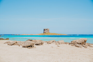 Sticker - Famous landmark Torre della Pelosa in a rocky island in Italy against a  light blue sky