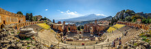 Beautiful View Of The Ancient Theater Of Taormina With Mount Etna In The Background, Sicily, Italy