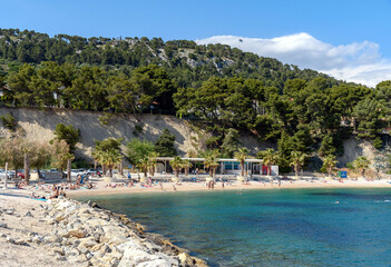 Beautiful view of people sunbathing and swimming on Jezinac beach at Marjan hill in Split, Croatia