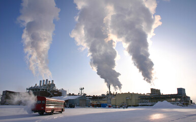 North slope processing plant emitting steam from stacks Alaska