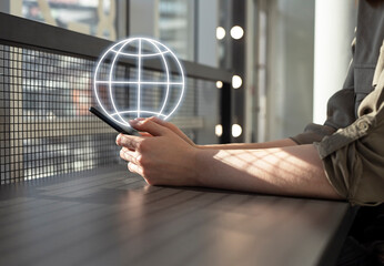 Poster - Woman using phone for searching information on Internet, chatting with international friends. Female sitting at table in cafe and holding smartphone. High quality photo