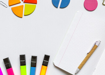 Wall Mural - School supplies, open notepad, rulers, fractions on a white background. Interesting, fun math for kids. Education, back to school concept
