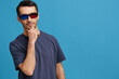 © SHOTPRIME STUDIO - Cheerful man Cheerful man in cinema glasses in a t-shirt isolated background