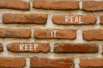 Wall Mural - Keep it real and support symbol. Concept words Keep it real on brick wall. Beautiful brick wall background. Business and support Keep it real quote concept. Copy space.