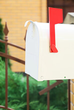 Vintage Mailbox With Red Flag Outdoors