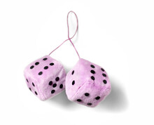 Pink Fuzzy Dice Isolated On A White Background