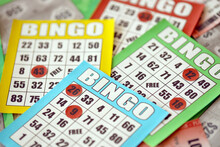 Many Colorful Bingo Boards Or Playing Cards For Winning Chips. Classic US Or Canadian Five To Five Bingo Cards On Bright Background