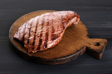 Wall Mural - Beef steak on a wooden background. Roast beef medium rare.