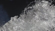 Abstract Slow Motion Shot Of Gurgling And Splashing Water Flowing Off Sideway
