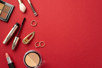 Wall Mural - Make-up beauty concept. Top view photo of lipstick contouring eyeshadow palettes mascara makeup brushes gold rings and hairpin on isolated red background with copyspace