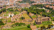 Aerial view of Colosseum and Palatine Hill in the historic center of Rome, Italy. According to the legend, it is from this hill that the history of Rome began. 