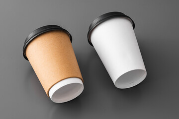 Wall Mural - Two paper takeout coffee cups on gray background