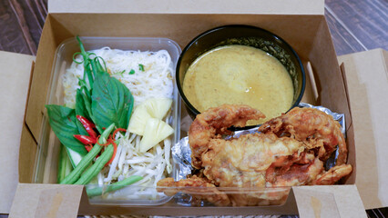 Wall Mural - A thai food in a paper box for delivery