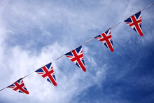 UK Union Jack Bunting Flags In Blue Sky Celebrating British Culture
