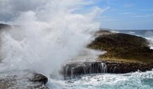 Seascape At The North West Shore Of Curacao At The Boka Pistol In The Shete Boka National Park,
Huge Wave Crashing Onto The Cliff With A Big Splash