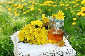 Wall Mural - Fresh dandelion flowers and honey