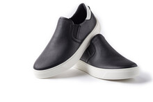 Pair of black leather slip-ons shoes on white background with copy space.