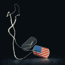 Falling US Military Soldier's Dog Tags In The Shape Of The American Flag With Chain. Memorial Day Or Veterans Day Concept.