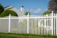 White Vinyl Fence In A Cottage Village Tall Thuja Bushes Behind The Fence Fencing Of Private Property