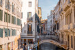 Cityscape of the beautiful narrow water channels on a sunny day in Venice. Traveling Italy concept