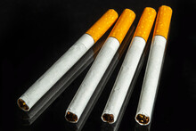 Some White And Brown Cigarettes, Cigarettes Allowed Only For Over Eighteen, Black Background