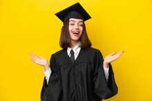 Young University Graduate Ukrainian Woman Isolated On Yellow Background With Shocked Facial Expression