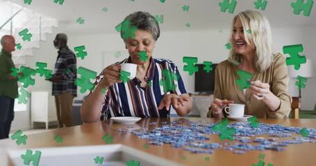 Sticker - Animation of puzzle over diverse group of seniors talking