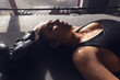 © Wavebreak Media - High angle view of exhausted caucasian young female boxer with eyes closed lying in boxing ring