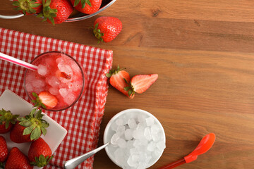 Wall Mural - Fruit granita with ripe strawberries of ice on table top