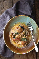 Canvas Print - Braised chicken legs with cream, spinach, garlic and smoked cheese