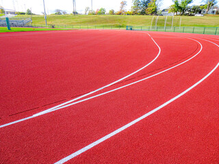 Wall Mural - Running track slot drain along radius, adjacent to steeplechase.