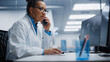 © Gorodenkoff - Medical Hospital Research Lab: Black Female Neurosurgeon Using Computer with Brain Scan MRI Images, Talking on the Phone with Sick Patient. Health Care Neurologist Finding Treatment. Energetic Arc