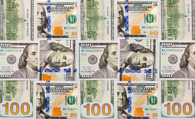 One Hundred Dollar Banknotes are creatively laid out. Money banknotes of US dollars, a lot of different money. Buy printing, banking. Cash income, wealth and financial independence.