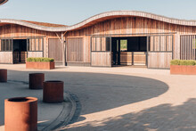 Design Stables In A Horse Education Center - Modern Horse Farm With Wooden And Steel Structures - Daylight